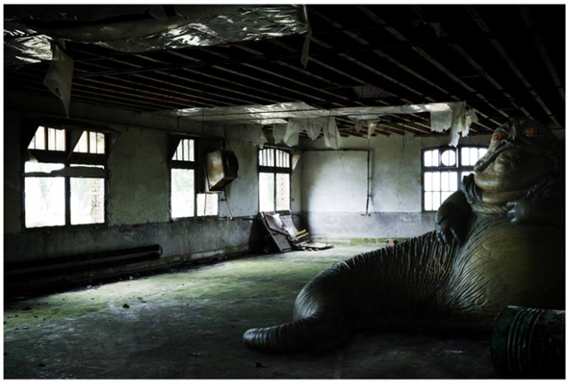 Image by Cedric Delsaux of Jabba the Hutt in a worn-out building.