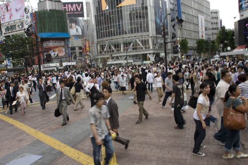 Loads of people crossing the street at Shibuya Crossing