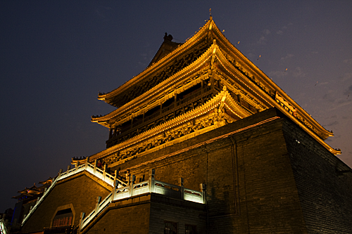 The Drum Tower illuminated at night.