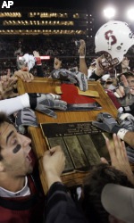 Stanford football players holding the Axe