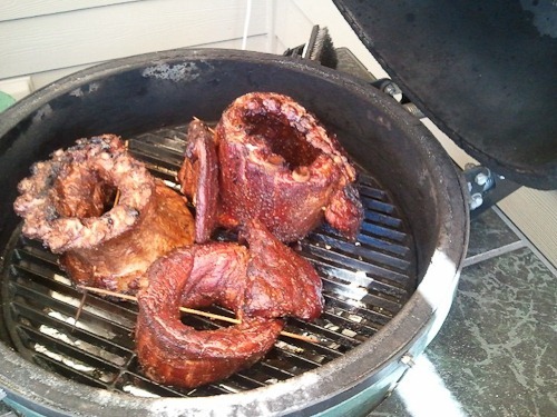 Three racks of pork ribs rolled and cooked like standing roasts in a Big Green Egg.