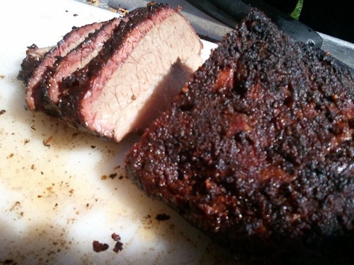 Close-up of sliced brisket with a lovely red smoke ring.