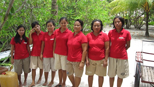 Seven lovely staff ladies in red polos and khaki shorts