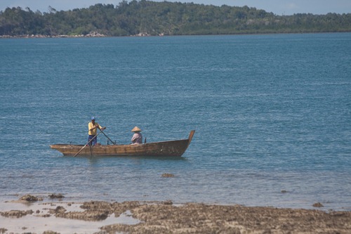 Traditional Indonesian row boat with two people